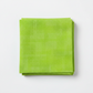 Interwoven Lime Fabric by Jason Yenter for In The Beginning Fabrics — neatly folded fat quarter showing vivid lime green crosshatch texture with subtle chartreuse to grass green tonal shifts. Clean white surface, soft natural light. 100% cotton, 43–44" wide.