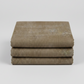 Folded Interwoven Olive quilting cotton fabric on a light grey background – by Jason Yenter for In The Beginning Fabrics. Shop at IraRobi Quilts | #olivefabric #interwoven #quiltingfabric #neutralfabric #blenderfabric