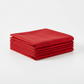 Interwoven Red Fabric by Jason Yenter for In The Beginning Fabrics — neatly folded fat quarter stack showing vivid true red crosshatch texture print with subtle tonal shifts from bright scarlet to deep warm red. Clean white surface, soft natural light. 100% cotton, 43–44" wide.