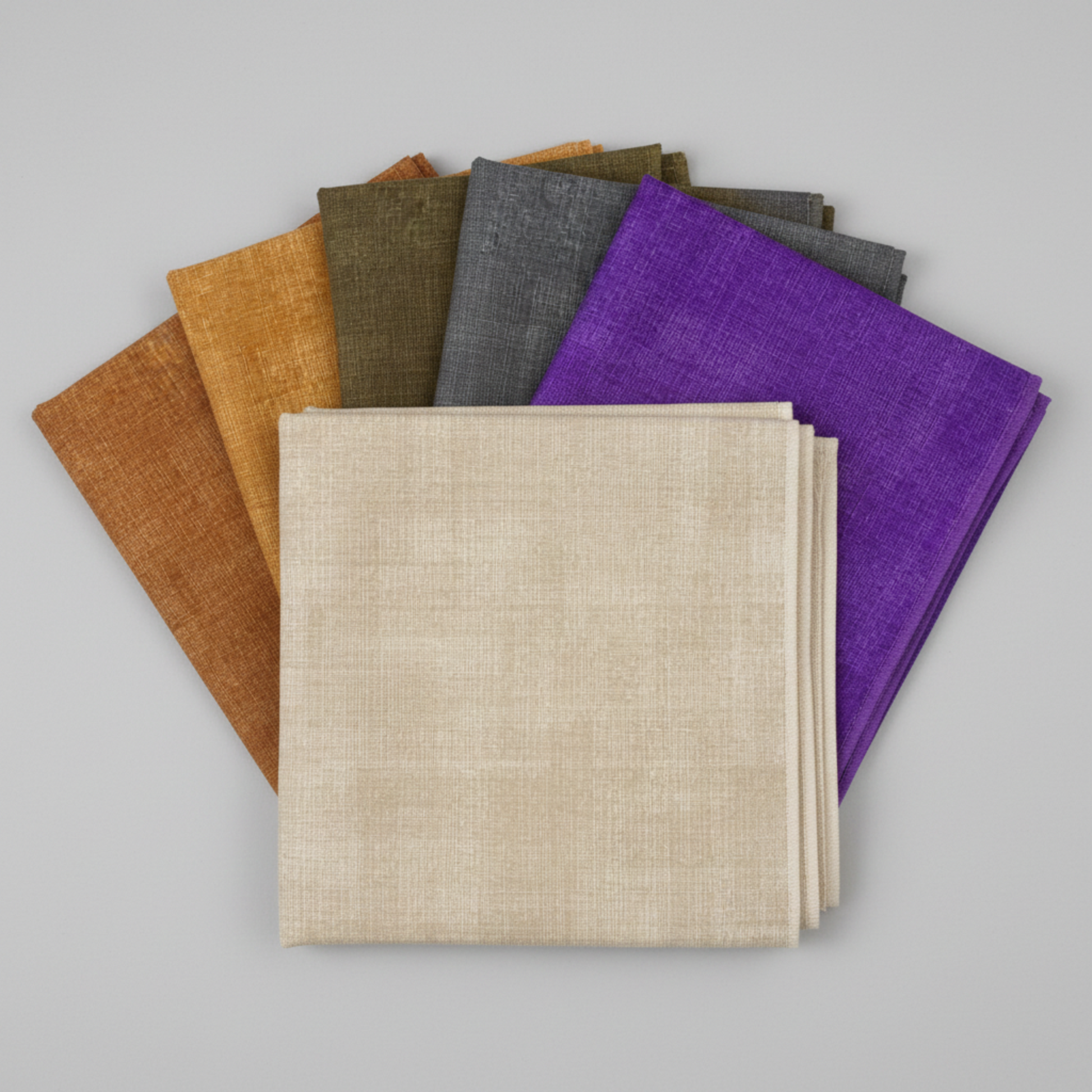 Interwoven Taupe Fabric by Jason Yenter for In The Beginning Fabrics — shown in a coordinating fan with Butterscotch, Olive, Slate, and Plum crosshatch quilting cottons on a light grey background, 100% cotton, 43–44" wide