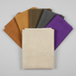Interwoven Taupe Fabric by Jason Yenter for In The Beginning Fabrics — vertical fan arrangement with coordinating Interwoven Butterscotch, Olive, Slate, and Plum crosshatch quilting cottons on a light grey background, 100% cotton, 43–44" wide