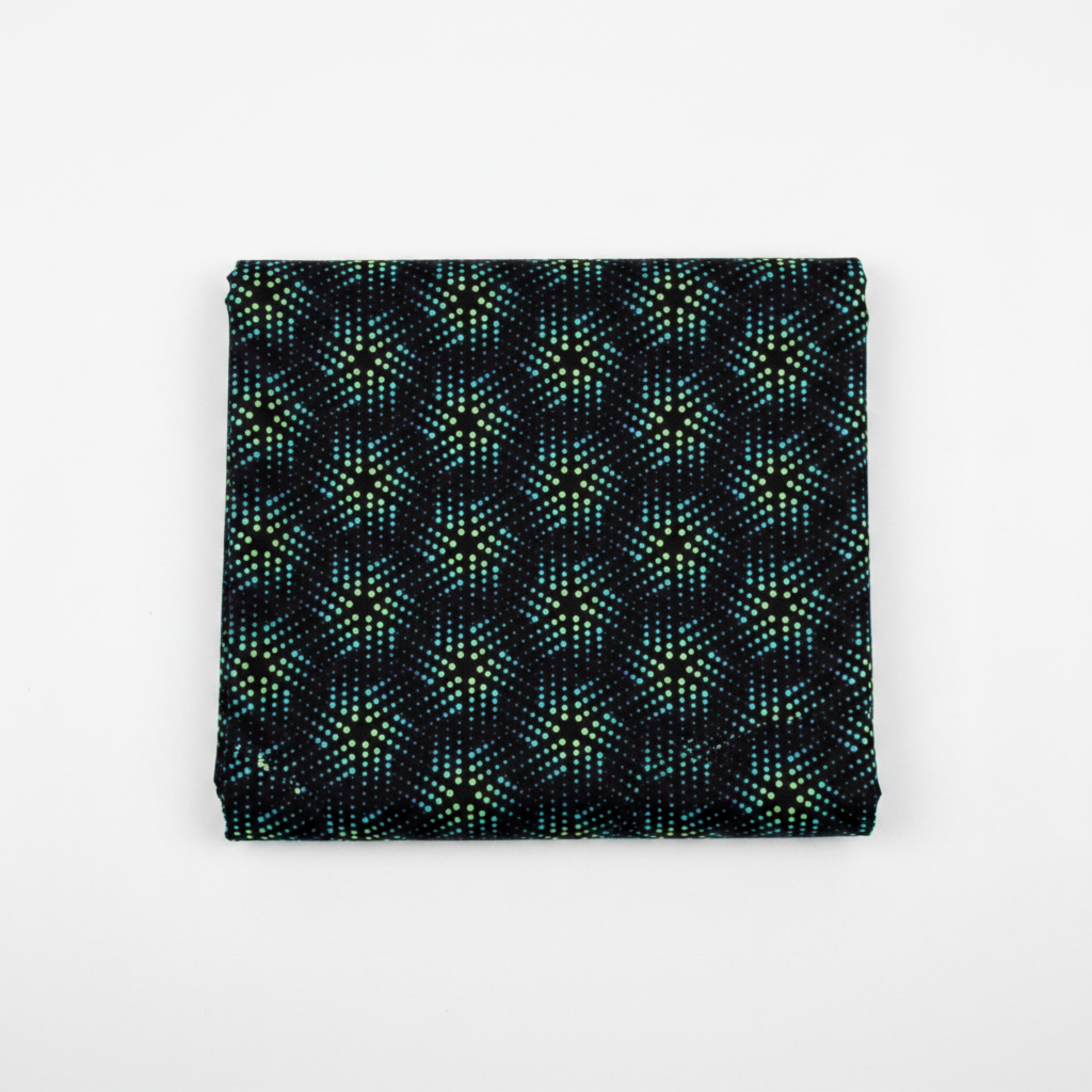 Folded swatch (1:1 — Shopify): La Luna Black Bursts quilting cotton fabric folded to show allover geometric star burst blender with large six-pointed star and snowflake bursts formed by rows of glowing hexagonal dots in teal, aqua, chartreuse, and soft lavender on deep black by Jason Yenter for In The Beginning Fabrics, 100% cotton, 3 yard cut