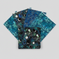 La Luna Black Bursts quilting cotton fabric by Jason Yenter for In The Beginning Fabrics shown in a fan with coordinating La Luna collection fabrics – geometric star burst blender with glowing hexagonal dots in teal, aqua, and chartreuse on deep black, with La Luna Blue Silver Moon Collage, Blue Night Blooms, and Teal Leaves, 100% cotton, 3 yard cuts