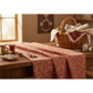 The Fox Homestead Pink Leaves And Berries quilting cotton by Stacy West for Henry Glass — fabric draped softly showing dusty rose-terracotta ground with tossed leaf-and-berry sprigs in muted gold, cream, and deep burgundy