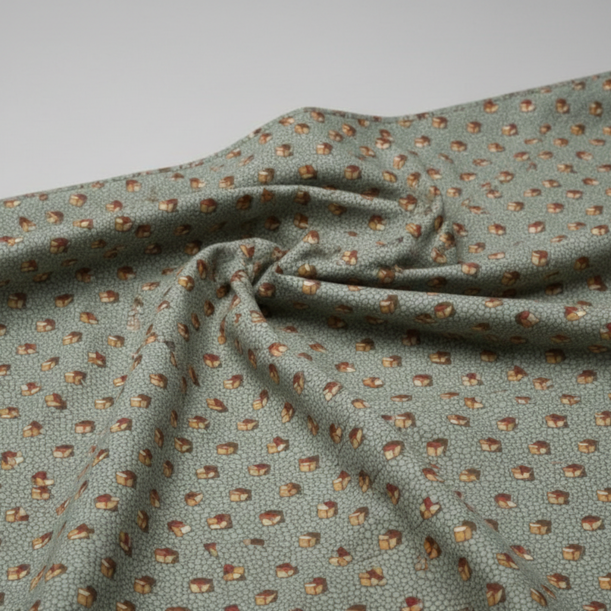 he Fox Homestead Slate Blue Green Tossed Cubes quilting cotton by Stacy West for Henry Glass — fabric draped softly showing muted slate blue-green ground with tossed tumbling cube motifs in gold, cream, and burgundy