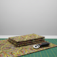 What If Good Vibes Gold/Multi quilting fabric with rotary cutter and cutting mat — bold kaleidoscopic geometric print by Paula Nadelstern for Benartex
