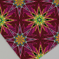 What If Radio Star Red/Multi quilting cotton macro detail — intricate kaleidoscopic starburst in magenta, crimson, black, and yellow-gold by Paula Nadelstern for Benartex