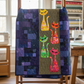 Interwoven Cherry Fabric by Jason Yenter for In The Beginning Fabrics as a cherry red cat appliqué in a finished Mod Cat quilt draped on a quilt ladder — deep red crosshatch tonal blender paired with yellow, green, and pink Interwoven colorways on a rich purple and blue scrappy background. Quilts shown for inspiration feature the Mod Cat Quilt Pattern by Colourwerx — available at IraRobi Quilts.