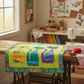 Interwoven Lime Fabric by Jason Yenter for In The Beginning Fabrics as the background in a Mod Cats appliqué quilt draped over a vintage treadle sewing table — three stylized cat appliqués in orange-yellow, teal-blue, and purple-pink batiks with multicolor batik border. Quilts shown for inspiration feature the Mod Cats Quilt Pattern — available at IraRobi Quilts.