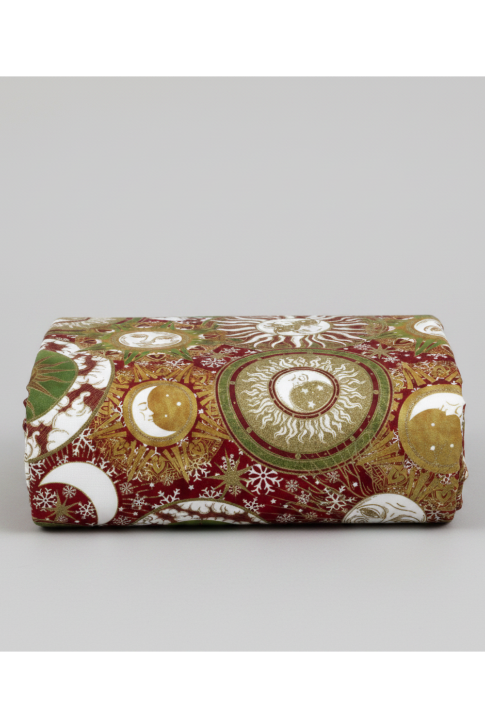 Winter Solstice II Multi Celestial Metallic quilting cotton by Jason Yenter for In The Beginning Fabrics — folded fabric bolt showing dense jewel-toned celestial collage with sun medallions, crescent moons, mandala rings, snowflakes, and clouds in deep crimson, forest green, gold metallic, and cream, 100% cotton with metallic accents, 43–44" wide. Quilt blocks shown for inspiration. Coordinating fabrics and quilt patterns are available at IraRobi Quilts.
