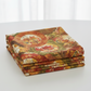 Autumn Celebration Multi Circles quilting cotton fabric by Jason Yenter for In The Beginning Fabrics — neatly folded stack showing the large-scale medallion circle print with layered autumn maple leaves in crimson, orange, golden yellow, and olive green on a warm earthy ground. Premium 100% cotton quilting fabric, 43–44" wide.