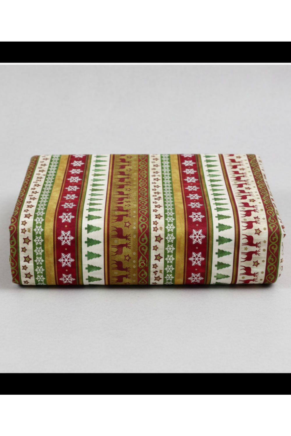 Winter Solstice II Multi Stripe Metallic quilting cotton by Jason Yenter for In The Beginning Fabrics — folded fabric bolt showing repeating vertical Christmas stripes with white snowflakes on crimson, watercolor trees on cream, burgundy reindeer on gold, and stars on white with metallic accents, 100% cotton, 43–44" wide. Quilt blocks shown for inspiration. Coordinating fabrics and quilt patterns are available at IraRobi Quilts.