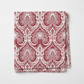 Nature's Winter Red Snowflake Ogee quilting cotton by Jason Yenter for In The Beginning Fabrics — folded fat quarter on a white surface showing bold white ogee lattice with intricate snowflake medallions and swirling paisley scrolls on mottled crimson and burgundy. 100% cotton, 43–44" wide.