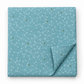 Olive You Net Sky Fabric by Zen Chic for Moda Fabrics, folded on a white background with one corner turned back, showing pale connected-dot lines and olive accents.