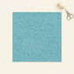 Olive You Net Sky Fabric by Zen Chic for Moda Fabrics, a square swatch laid flat on an ivory background beside cream thread and silver embroidery scissors. ⠋