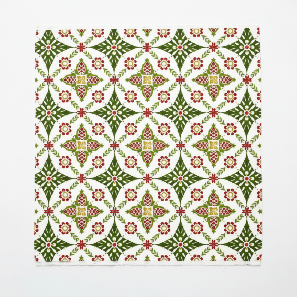 NYSNO New Snow Multicolor Garland quilting cotton by Jason Yenter for In The Beginning Fabrics — close-up flat lay showing dense symmetrical medallion allover with pine cone motifs, crimson red flowers, and olive green leaf sprays in forest green, red, and gold on crisp white. 100% cotton, 43–44" wide.