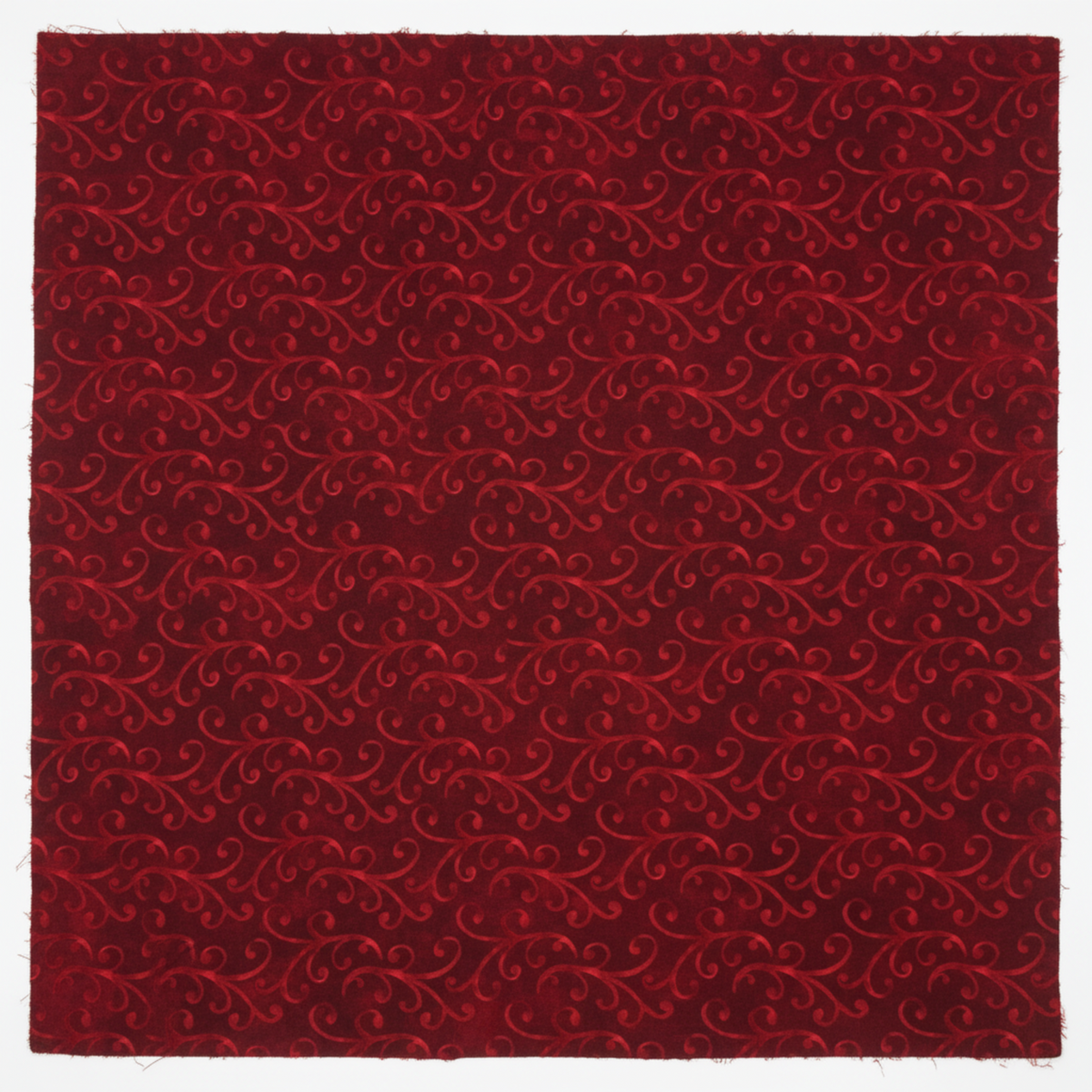 NYSNO New Snow Red Swirl quilting cotton by Jason Yenter for In The Beginning Fabrics — close-up flat lay showing dense interlocking tone-on-tone crimson scrolls on a richly mottled deep red ground, luxurious tonal blender print, 100% cotton, 43–44" wide.