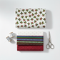 NYSNO New Snow White Holly quilting cotton by Jason Yenter for In The Beginning Fabrics — folded as the hero on a stack of coordinating winter fabrics with silver thread spools and silver scissors on a white surface. Coordinating fabrics and quilt patterns available at IraRobi Quilts.