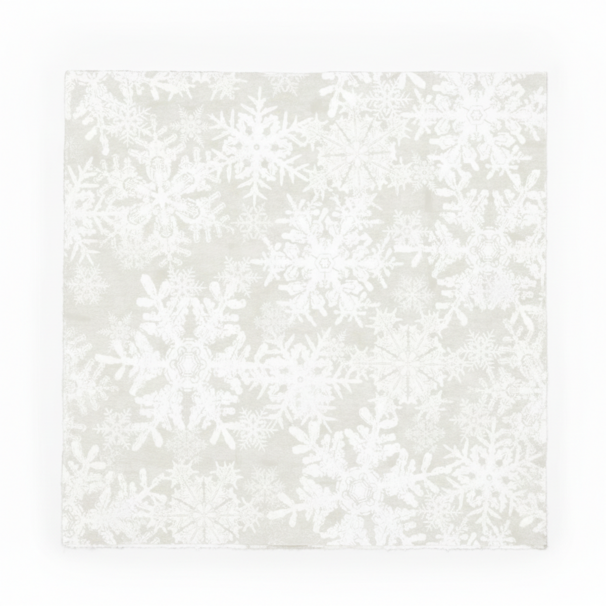 NYSNO New Snow White Snowflakes quilting cotton by Jason Yenter for In The Beginning Fabrics — close-up flat lay showing densely scattered white-on-white snowflake silhouettes on a soft mottled ground, tone-on-tone allover print, 100% cotton, 43–44" wide.