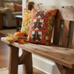 Oh Snap! gingerbread quilt pillow with Autumn Celebration Multi Vegetables harvest border fabric by Jason Yenter for In The Beginning Fabrics — cozy fall home décor on a rustic wood bench with pumpkin and Indian corn. Quilts shown for inspiration feature the Oh Snap! pattern by Jennie Jo Lamb — available at IraRobi Quilts.