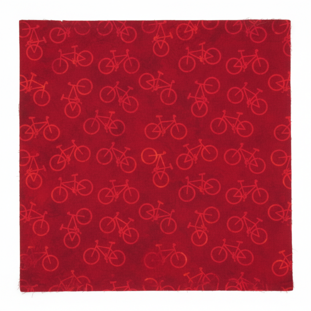 On the Go Bicycles Red quilting cotton by Jason Yenter for In The Beginning Fabrics — close-up flat lay showing scattered road bicycle silhouettes in warm crimson on a deep burgundy-red mottled ground, tone-on-tone all-over print, raw cut edges visible, 100% cotton, 43–44" wide.