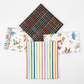 On the Go Plaid Multi quilting cotton by Jason Yenter for In The Beginning Fabrics — shown as the hero on top of a coordinating fabric fold stack on a clean white surface with bright studio lighting.