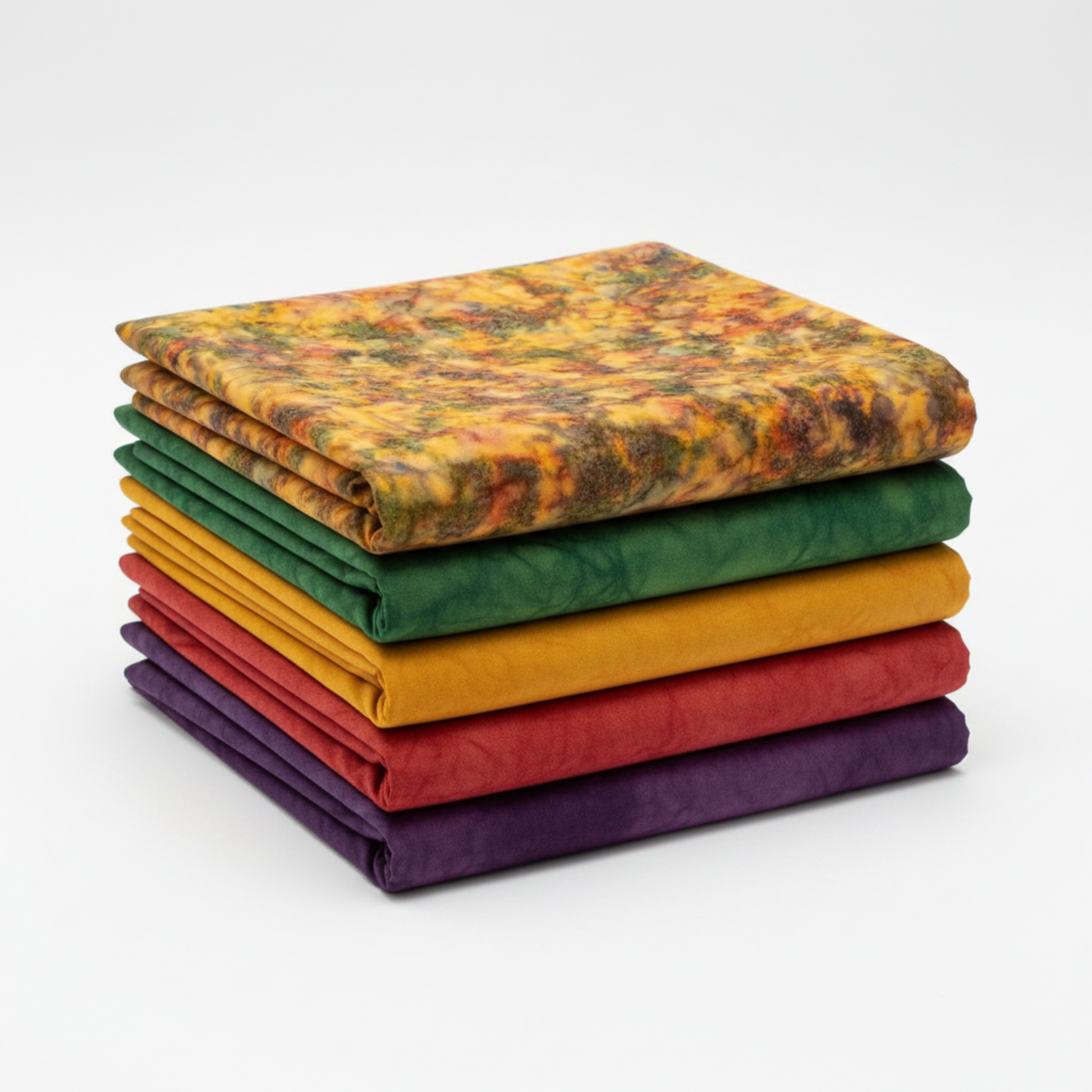 Expressions Batiks Hand-Dyes Orange Multi I fabric by Riley Blake Designs on top of a coordinating stack of five Expressions Batiks Hand-Dyes tonal batik fabrics – complex multicolor amber-orange on top with forest green, curry yellow, tomato red, and deep purple tonal batiks below, 100% cotton