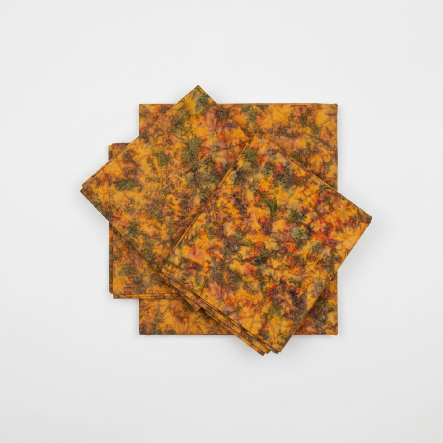 Expressions Batiks Hand-Dyes Orange Multi I quilting cotton fabric by Riley Blake Designs folded into a neat square showing complex multicolor hand-dyed batik with warm golden amber-orange base layered with olive green, slate blue-grey, muted purple, and burnt red-orange – a rich earthy-forest focal blender, 100% cotton batik, 43–44" wide