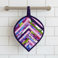 Leaf-Shaped Quilted Hot Pad – Indigo Berry hanging on oven handle, pointed tip down | Handmade by IraRobi Quilts