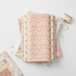 Patricia Coral Lace 3-Yard Cut quilting cotton by Jason Yenter for In The Beginning Fabrics — shown in a coordinating fabric fold stack with soft ivory, dusty rose, warm cream, and peach Patricia collection fabrics, with lace trim and pearl buttons alongside. Coordinating fabrics and quilt patterns are available at IraRobi Quilts.