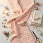 Patricia Coral Lace 3-Yard Cut quilting cotton by Jason Yenter for In The Beginning Fabrics — loosely draped on white linen with coordinating blush and ivory Patricia fabrics, dried pink roses, pearl buttons, gold scissors, and ivory thread spools in a romantic feminine quilting room. Coordinating fabrics and quilt patterns are available at IraRobi Quilts.