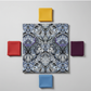 Fabric coordination flat lay featuring What If Prima Donna Grey/Blue damask with Interwoven Yellow, Tomato, Plum, and Periwinkle quilting cottons