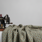 The Fox Homestead Slate Blue Green Tossed Cubes by Stacy West for Henry Glass — slate blue-green quilting cotton with tumbling cube motifs in gold, cream, and burgundy, 100% cotton 43–44" wide