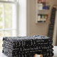 Writing on the Wall Curves Black quilting cotton flat lay with thread spools, scissors and buttons – bold black and white script print by FreeSpirit Fabrics