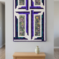 The Wondrous Cross purple, teal, and white cross wall quilt displayed above a small oak console with a pale ceramic vase in a light-grey entryway.