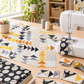 Vertical Pinterest view of an unfinished Spotted Geese quilt featuring Celestial News Dropping Onyx fabric beside an unbranded sewing machine and quilting tools. Quilts shown for inspiration feature the Spotted Geese Quilt Pattern by Zen Chic — all available at IraRobi Quilts.