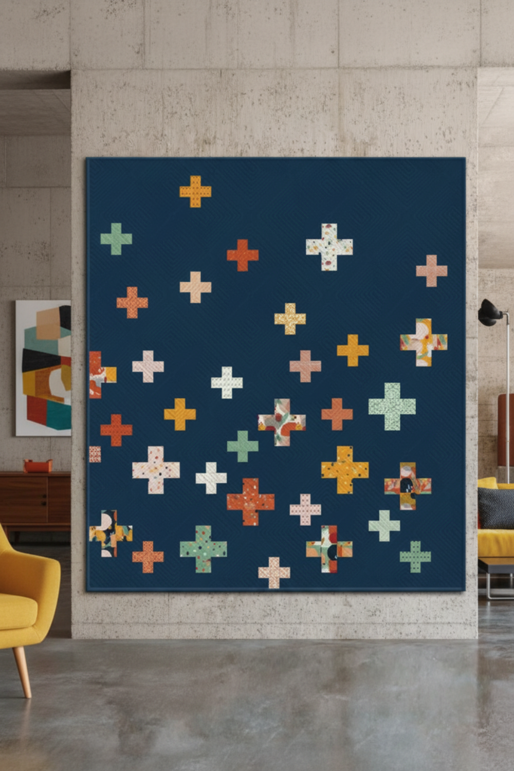 Spotted Mood Dark Blue fabric by Zen Chic for Moda Fabrics shown as the background in a modern plus-block quilt with coordinating warm-toned fabrics — available at IraRobi Quilts.