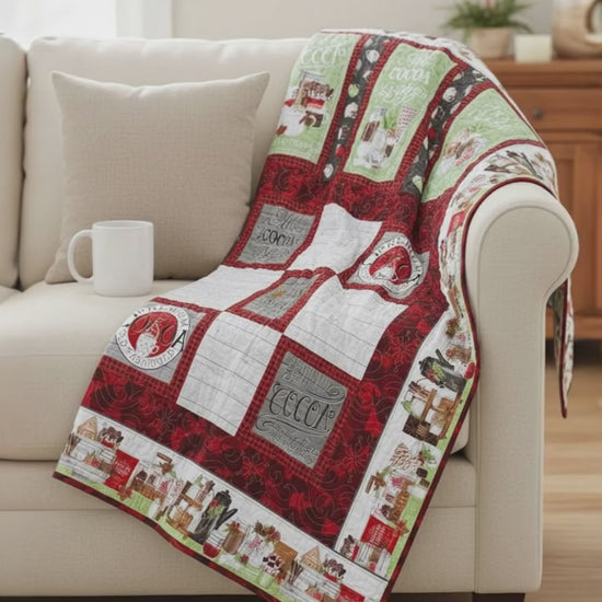 Handmade cocoa-themed winter quilt in red and green.