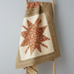 Traditional Ohio Star quilt featuring Front Porch quilting cottons by Dolores Smith for Marcus Fabrics — rust-amber, taupe, and olive-gold with cream background, 100% cotton 43–44" wide — shop at IraRobi Quilts