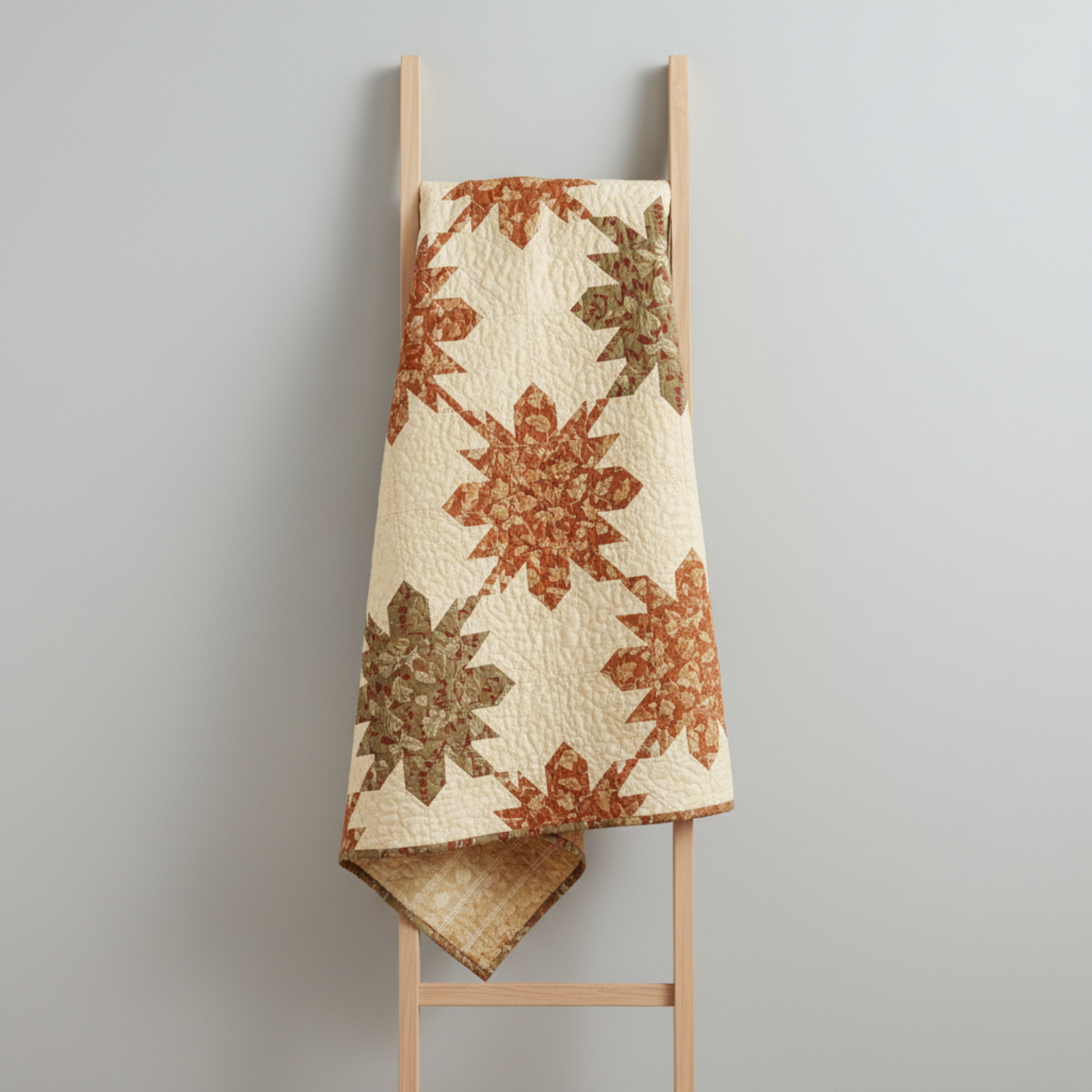 Traditional Ohio Star quilt made with Front Porch coordinating fabrics by Dolores Smith for Marcus Fabrics — rust-amber Swing leaf print, taupe Railings stripe, and olive-gold Railings stripe with cream background, 100% cotton