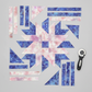 Fire & Ice by Maywood Studio Peach Ice Dye and coordinating cotton quilting fabric cut into quilt block pieces with a rotary cutter on light grey background