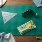Creative Grids 45 degree Kaleidoscope ruler on cutting mat with rotary cutter for precision quilting