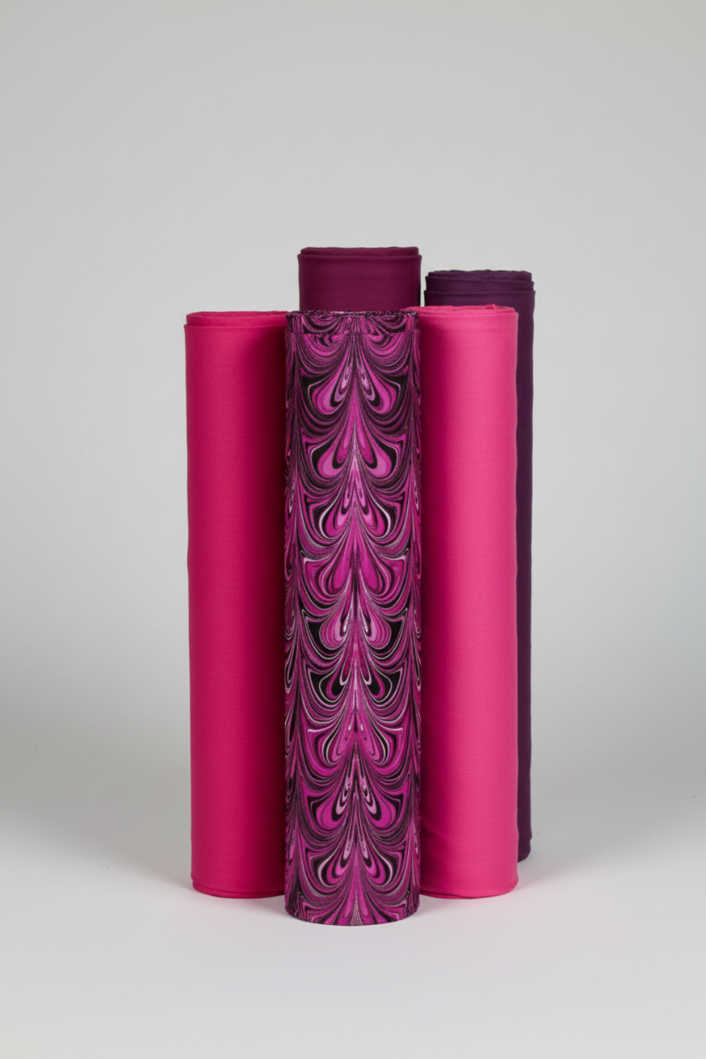 Needle Stars Chandelier Fuchsia coordinated with Interwoven Magenta, Hot Pink, and Plum quilting cottons — fabric rolls by Paula Nadelstern for Benartex