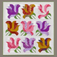 Rose Garden handmade quilt with nine pink, purple, and golden-toned rose blocks, green leaves, and green binding on a warm grey background.