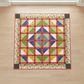 Safari Fun quilt kit finished quilt laid flat on light wood floor – 56x56 inch medallion design with jungle animal prints, red coral sashing, black dot cornerstones and safari animal border