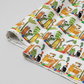 Safari Fun Stripe White/Multi by Terry Runyan for Benartex – fabric rolled and folded at an angle showing the jungle animal stripe print and fabric drape, light grey background