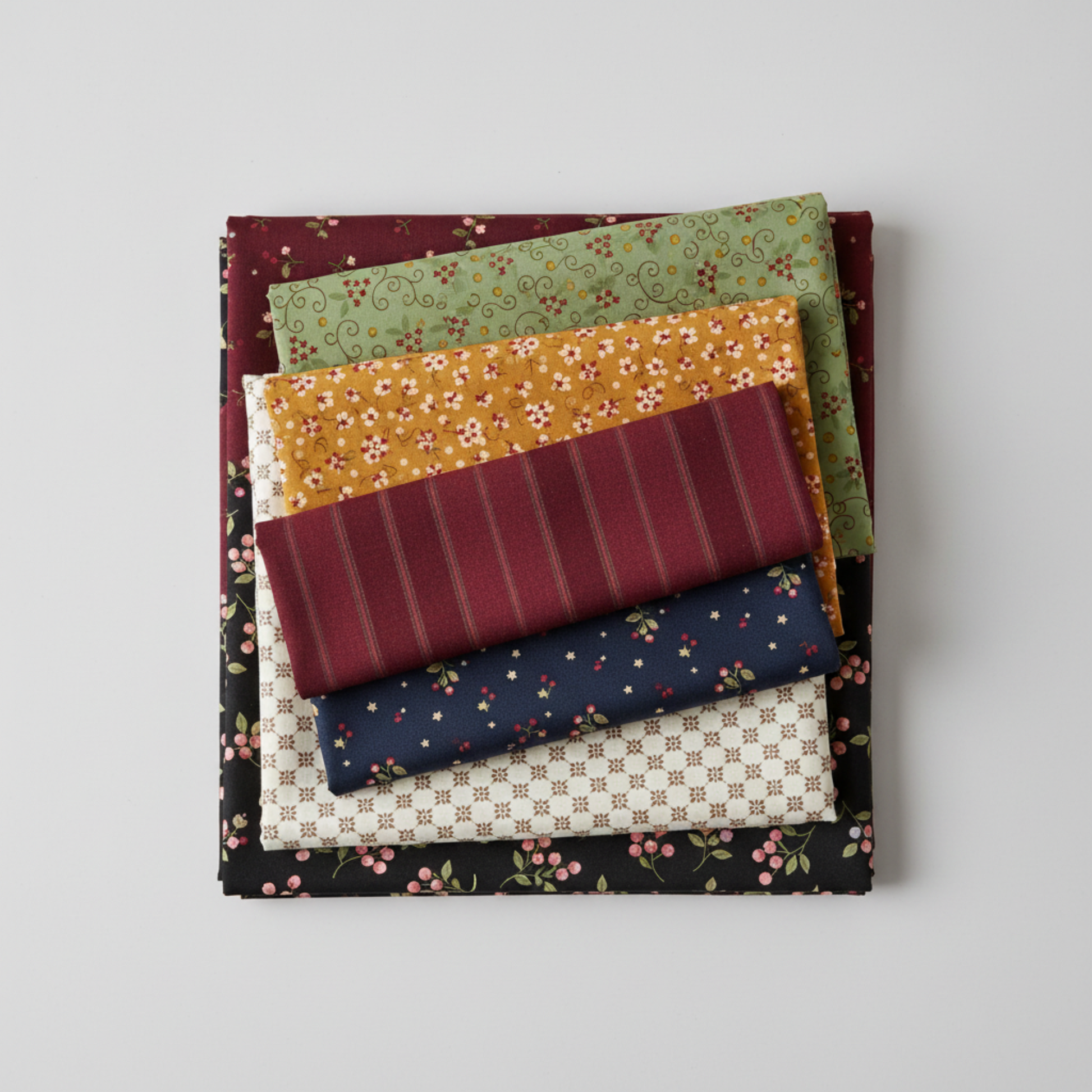 Scraps of Kindness collection coordinating fabric stack — aqua vine print with mustard, burgundy, navy, cream, and black quilting cottons
