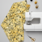 Heat Wave Bask Sun quilting cotton styled in modern sewing room with white sewing machine — golden yellow abstract print by Katie Pasquini Masopust for FreeSpirit Fabrics