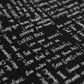 Close-up of Writing on the Wall Curves Black quilting cotton showing white handwritten script phrases: Curves Rock, Love your curves, Sew Kind of Wonderful