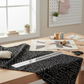 Writing on the Wall Curves Black quilting cotton spread on a modern quilting workspace with ruler and notions – Sew Kind of Wonderful for FreeSpirit